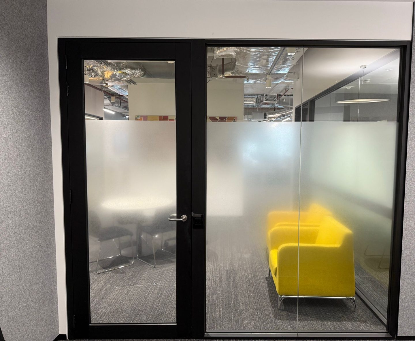 Frosted window film band across a glass office door and partition at 447 Collins Street, Melbourne