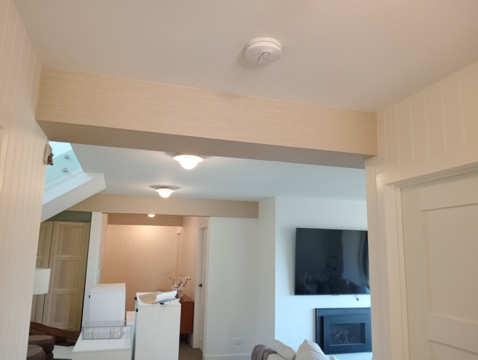 Light oak look architectural vinyl applied to plaster bulkheads in a Ferny Creek home