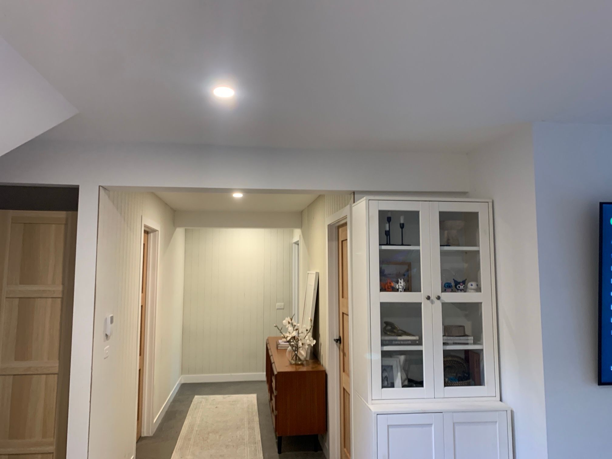 Painted plaster bulkhead before architectural vinyl was installed