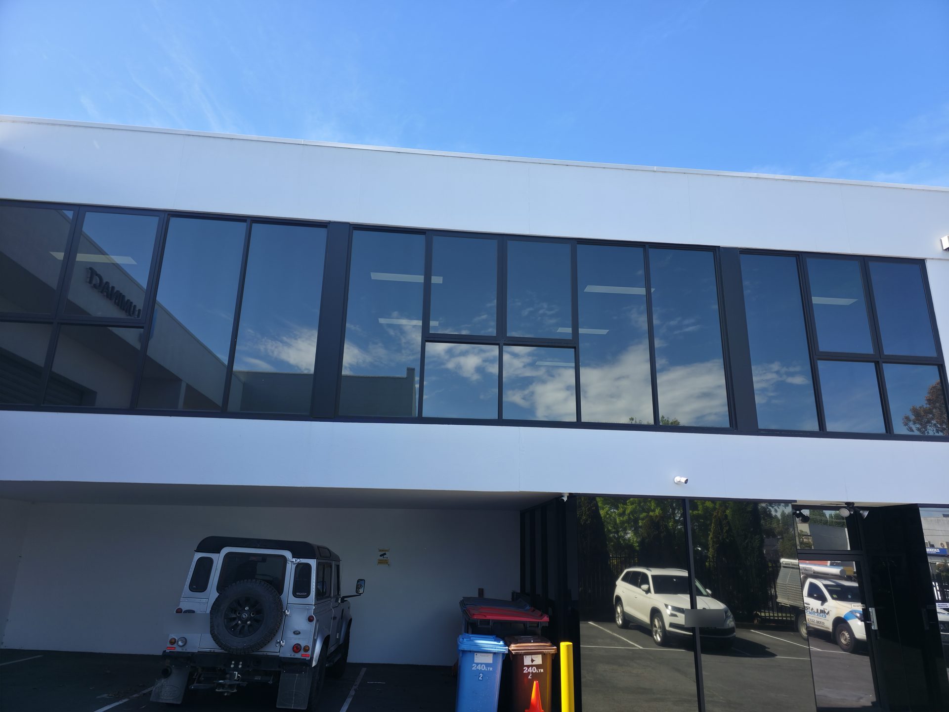 Reflective window film on the first-floor office windows of the Luminact building in Scoresby, Melbourne