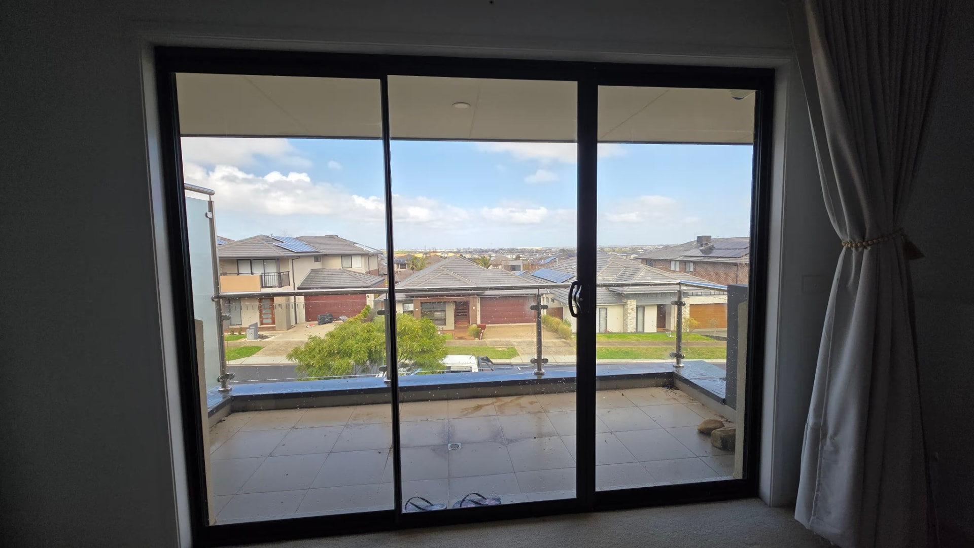 Outward daytime view through 3M Night Vision 25 in a Clyde North home