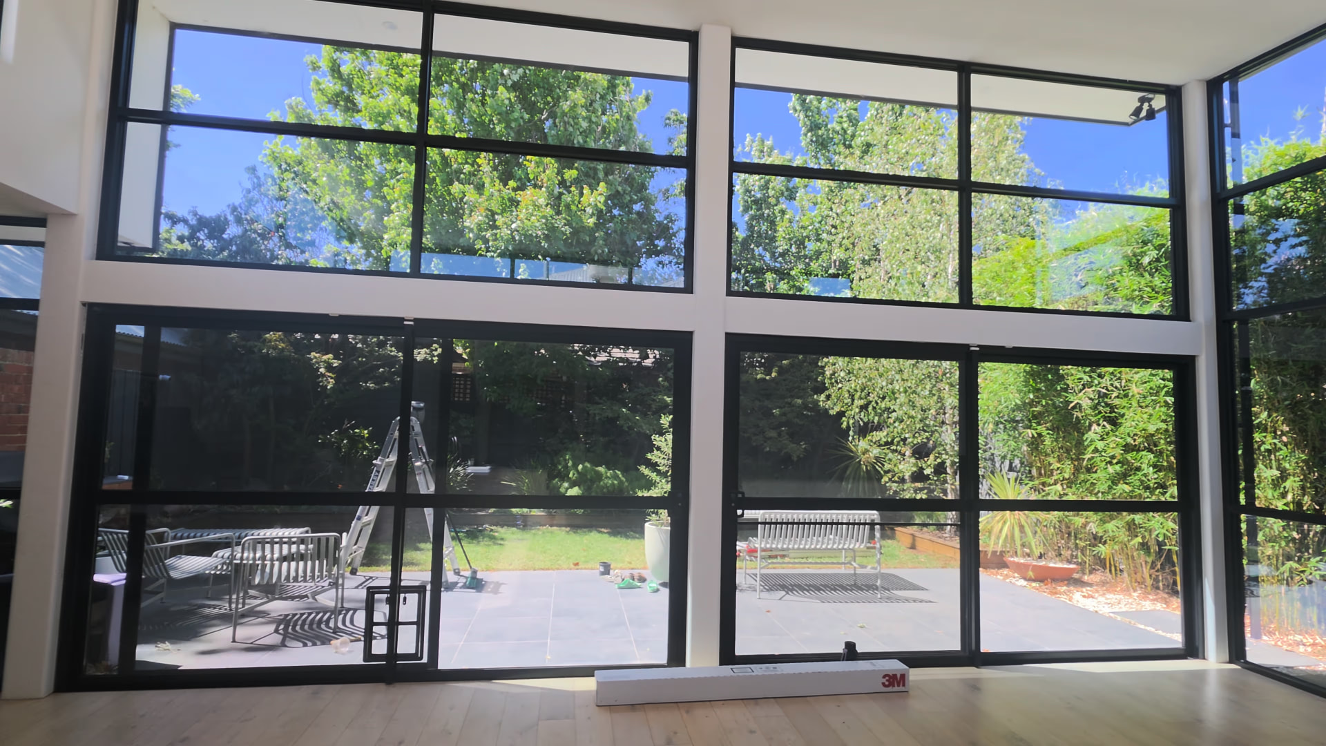 Interior view through large residential windows with 3M Prestige 70 window film
