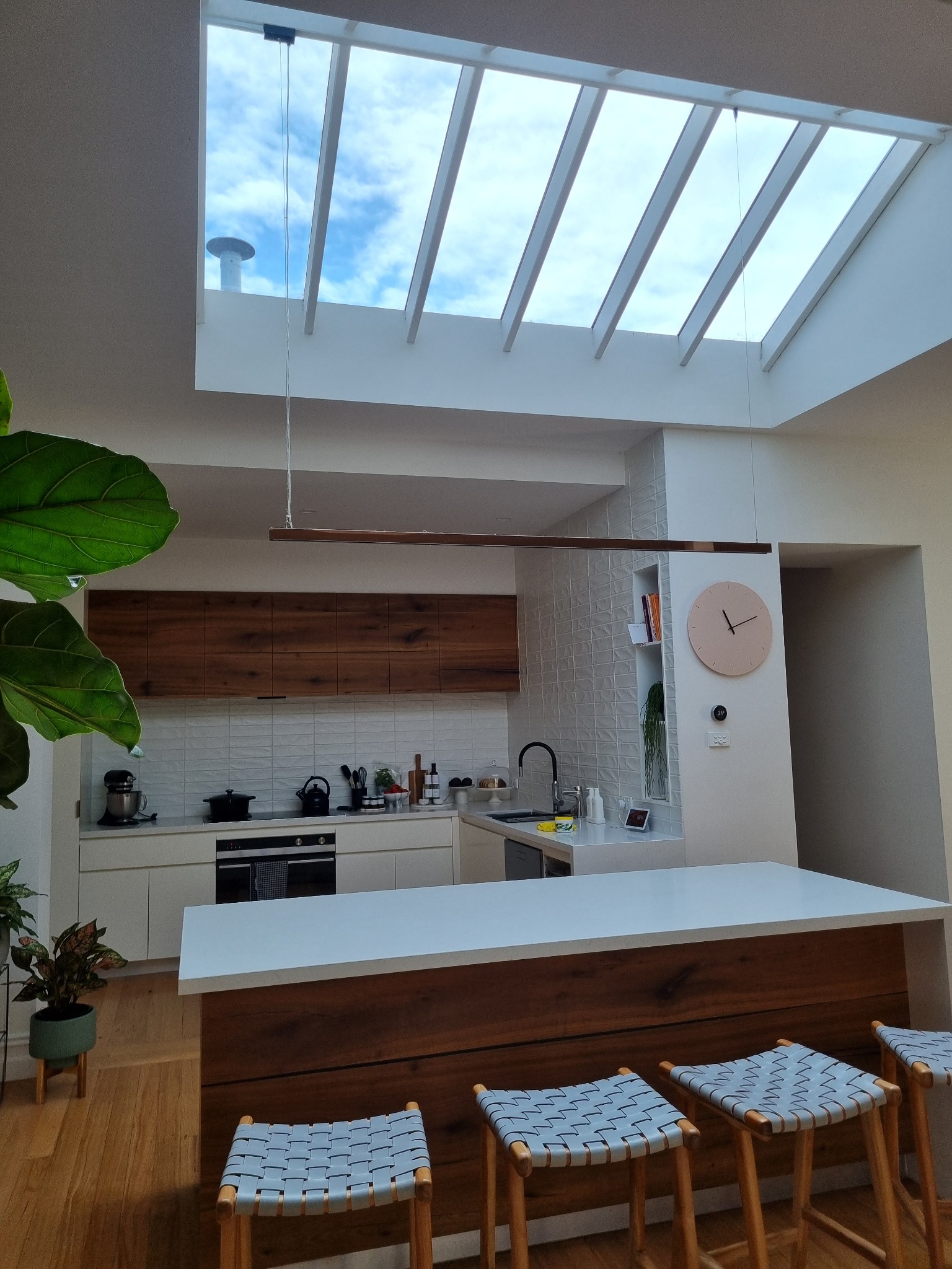 Residential kitchen with large glazed skylight bringing in natural light