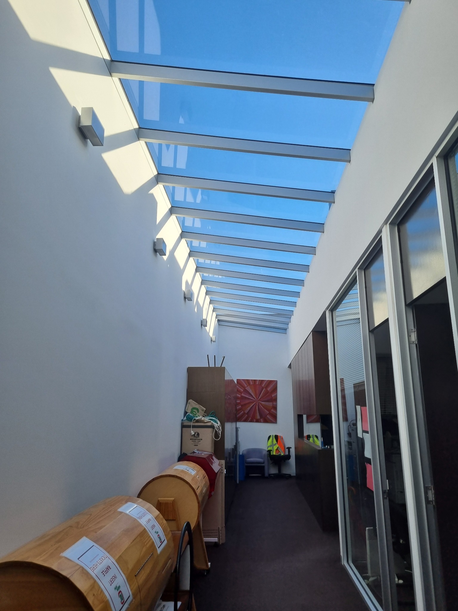 Long atrium with extensive overhead glass roof