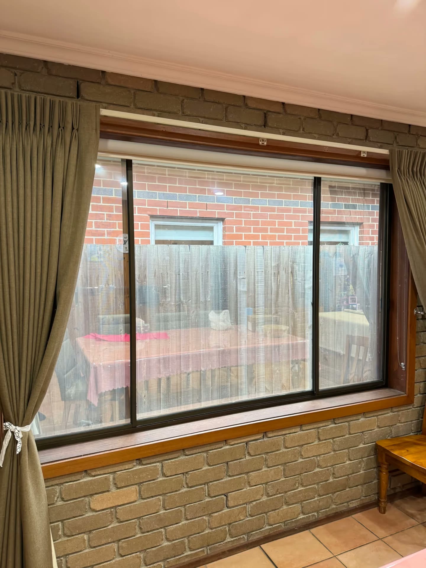 ASWF Reflection 20 window film installed with curtains and a roller blind in a Newport home